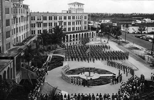 Flag-raising ceremony in front of Embry-Riddle School of Aviation, located in Miami. 1940s. Miami News Collection, HistoryMiami. 1989-011-18473.