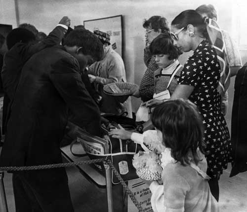 Security personnel at Miami International Airport conduct bag searches. January 5, 1973. Miami News Collection, HistoryMiami. 1989-011-9986.