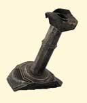 Pewter candle stand (bent). 17th century. 22.1 x 16.0 cm. Institute of Jamaica, 1997/1113.